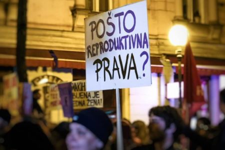 Protesters holding placard reading “What’s the cost of reproductive rights?” during March 8 rally, Zagreb, Croatia. Photo: Aktiv