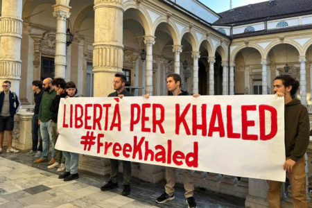 Italian youth hold up a Free Khaled banner (Image via FGC)