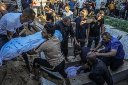 Members of the Al-Hijazi family bury the bodies of their relatives who were killed in an Israeli air strike in Rafah, in southern Gaza. (Photo: Abed Rahim Khatib/DPA via Zuma Press/APA Images)