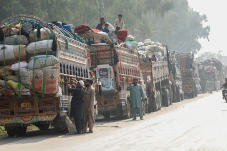 Thousands of Afghan refugees were forced to flee Pakistan. Pictured here are trucks loaded with the belongings of fleeing Afghan refugees outside the United Nations in Nowshera, Pakistan, October 30, 2023. (Photo: Fayaz Aziz/Reuters)