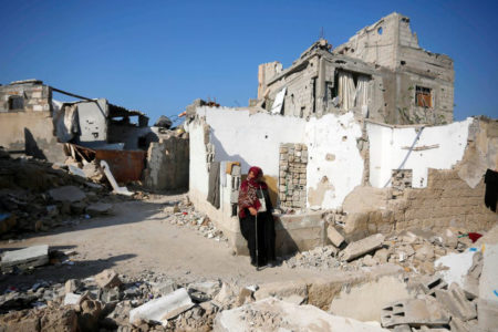 A woman is seen sitting in the debris of a destroyed building after Israeli attacks in Deir el-Balah in the central Gaza Strip on December 19, 2023. (Photo: Ashraf Amra/Anadolu Agency)