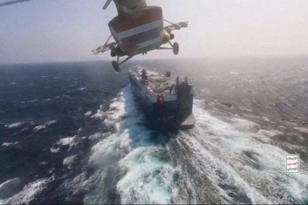 A November 20, 2023 file photo of a Houthi military helicopter flying over Galaxy Leader cargo ship in the Red Sea. (Photo: Indian Punchline)