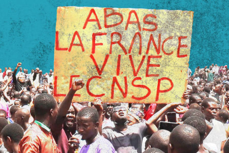 Protesters in Niger hold signs in support of the CNSP and against France.