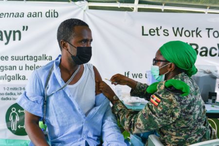 A trader is vaccinated in Mogadishu. Photo: AMISOM Public Information, CC0, via Wikimedia Commons