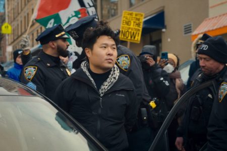 A protester gets arrested at a march in Washington Heights, allegedly for utilizing a speaker (Photo: Craig Birchfield)