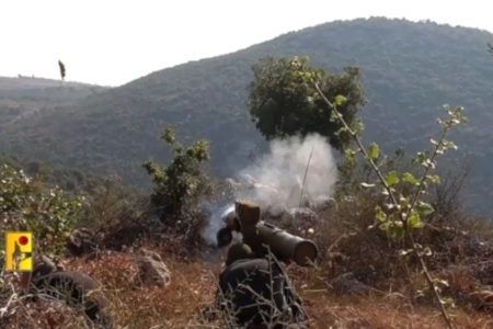 A Hezbollah fighter firing anti-tank missiles at an Israeli military target near the Israel-Lebanon border. Photo: Hezbollah Military Media via Al Mayadeen