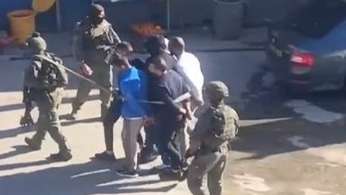Screenshot of a video showing Israeli occupation forces tying up and dragging away six Palestinian youths on March 11, 2024. Photo: Wafa News Agency