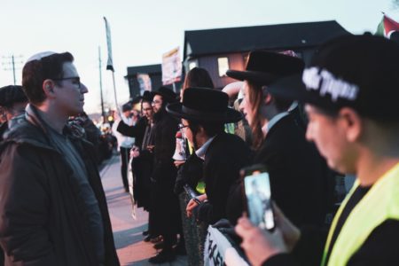 Zionist protesters confronting members of Neturei Karta participating in a pro-Palestine protest in Cedarhurst, Long Island.