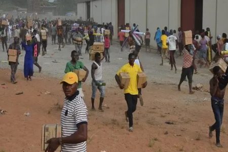 Residents loot a warehouse in Nigeria's Federal Capital Territory. Photo: Vanguard