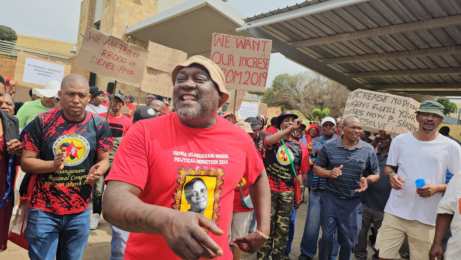 Workers picket the office of South Africa’s largest defense industry