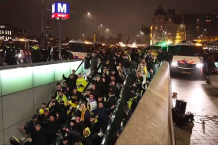 Fans of Maccabi Tel Aviv stage a pro-Israel demonstration near Central Railway Station, lighting up flares and chanting “Let the IDF win” and “F*** the Arabs!” ahead of the UEFA Europa League match between Maccabi Tel Aviv and Ajax in Amsterdam, Netherlands on November 07, 2024. Maccabi fans clashed with Amsterdam citizens and ripped off Palestinian flags hung on the streets (Screenshot via NBC News)