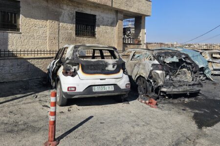 Incinerated cars in Al-Bireh after the settler attack. Photo: Aseel Saleh / Peoples Dispatch