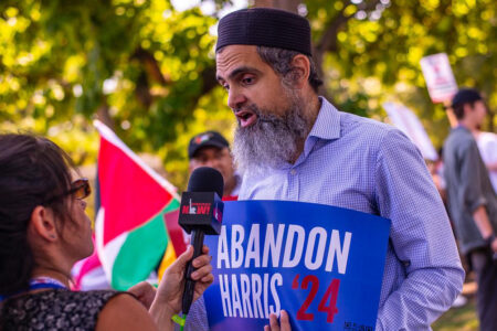 Dr. Hassan Abdel Salam speaks with a reporter (Photo via Abandon Harris)