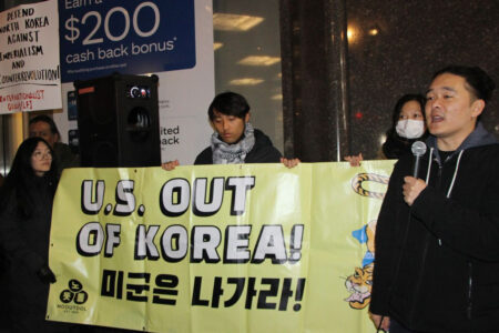 Demonstrators protest outside the ROK consulate in New York City on December 4 (Photo: Pauline Park)