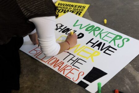 Activists in Houston, Texas designing signs for Inauguration Day protests. Photo: Vivek Venkatraman