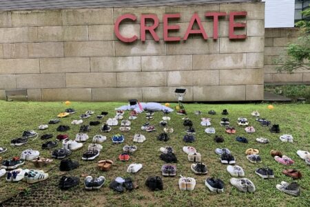 Students placed 124 pairs of shoes and a white burial shroud in front of CREATE, which houses the Singapore-Hebrew University Alliance for Research and Education — a partnership between NUS, Nanyang Technology University (NTU), and the Hebrew University of Jerusalem. Photo: SSP
