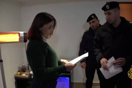 PA security officials issuing the suspension order to Al Jazeera. Photo: Screenshot Al Jazeera