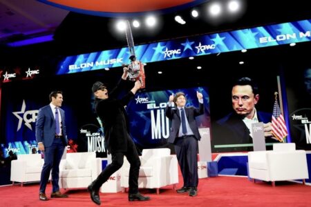 Javier Milei giving Elon Musk a chainsaw during CPAC. Photo: Elon Musk / X