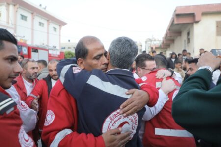PRCS workers bidding farewell to the 8 PRCS workers who were targeted and killed by Israel. Photo: PRCS