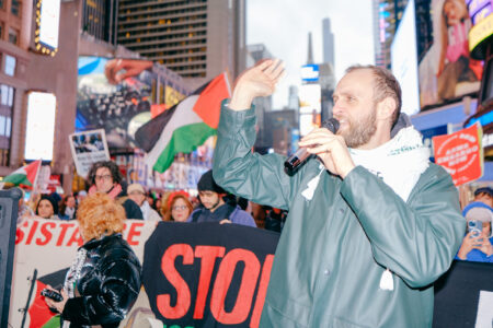 Taher Dahleh, leader in the Palestinian Youth Movement, speaks at a demonstration in Times Square, New York City (Photo: Wyatt Souers)