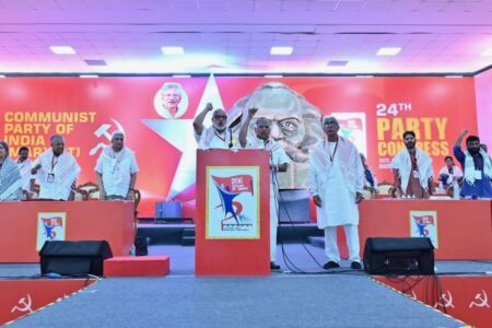 Delegates wearing keffiyehs rise in unison in solidarity with the #Palestinian people at the CPI(M) 24th Party Congress. Photo: CPI (M)/X