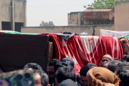 Residents of Daraa held a funeral ceremony for the civilian martyrs killed Wednesday evening by Israeli airstrikes targeting a town located between the city of Nawa and the village of Tasil, west of the province. Photo: SANA