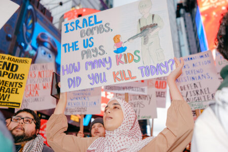 Protesters in Times Square denounce US support for Israeli genocide (Photo: Wyatt Souers)
