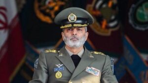 all revolutionary forces must unite behind this slogan: ‘Hands Off Iran!’
