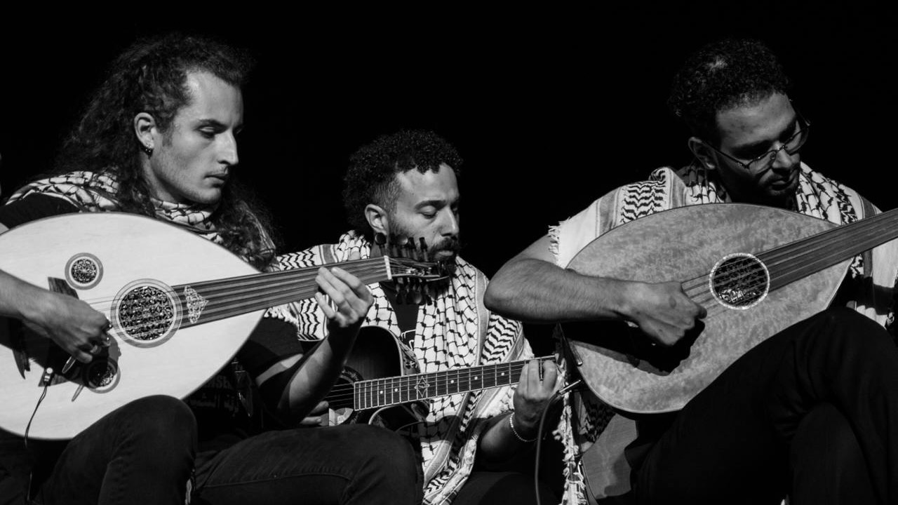 three palestinian musicians playing ouds