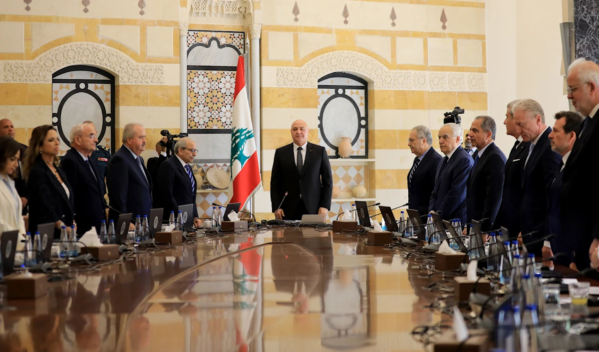 Cabinet members standing around table