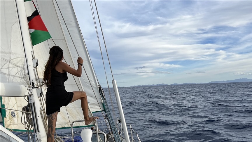 Woman on a boat with Palestine flag