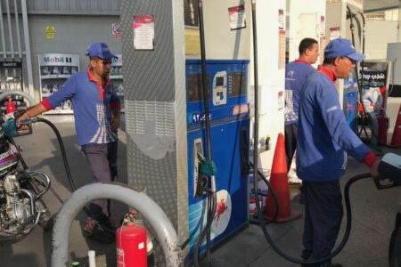 Egyptians suffer yet another IMF-instigated price hike Workers fuel vehicles at a gas station in Cairo, Egyp