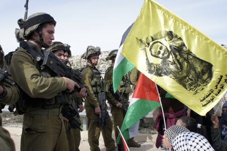 The genocide will not end until the Palestinian political leaders are free flag demanding release of Marwan Barghouti