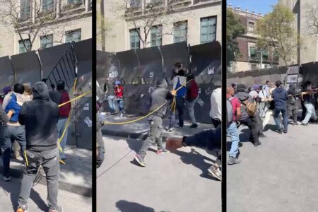 Mexico zocalo protesters tearing down Protesters tearing down steel fence Zocalo Mexico City