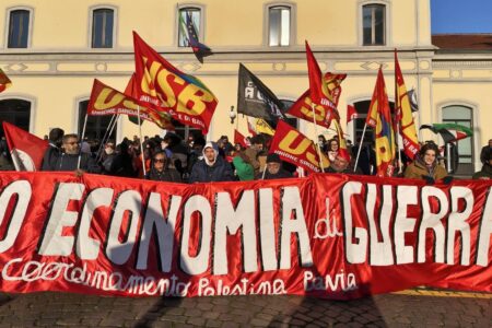 No economia di guerra Pap Pavia Strikers and activists holding banner reading "No to the war economy" during November 28 general strike in Italy. Source: Potere al popolo Pavia/Facebook