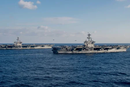 Two US Aircraft Carriers in South China Sea near Taiwan performing military drills Nimitz-class aircraft carriers USS Carl Vinson (CVN-70), left, and USS Abraham Lincoln (CVN-72) transit the Philippine Sea/South China Sea on Jan. 22, 2022.
