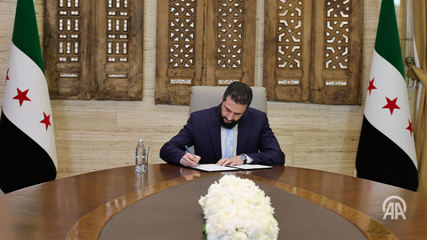 Ahmad Al-Sharaa signs document