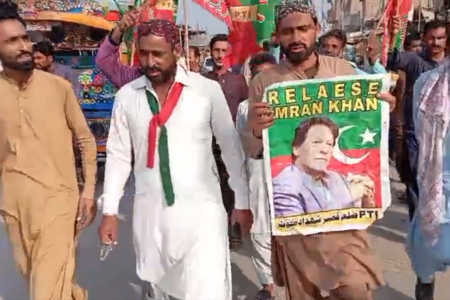 Pakistan protest Protesters hold poster of former Prime Minister of Pakistan, Imran Khan, during national strike