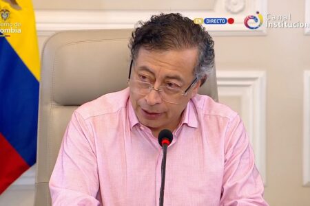 Colombian President Gustavo Petro gives address about bombings from Ecuador Colombian President Gustavo Petro sits at microphone in front of Colombian flag