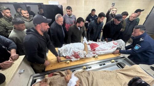 The bodies of the two martyred brothers, Muhammad and Fahim Muammar, arrived at Rafidia Hospital in Nablus (1)