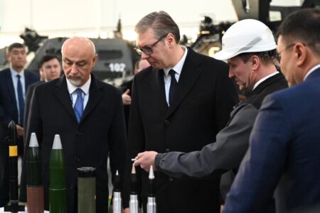 Elbit systems Serbian President Aleksandar Vučić looks at military products on table