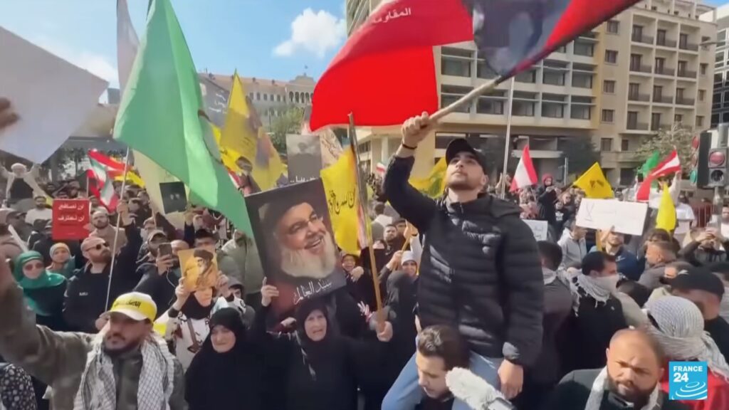 Protesters raise Lebanese flags in Beirut