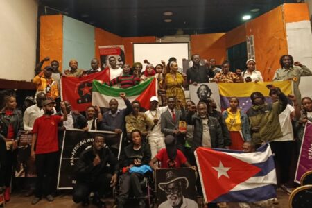 Africa liberation day commemoration in Kenya Kenyan socialists and leftists raise international revolutionary flags during a forum for African Liberation Day