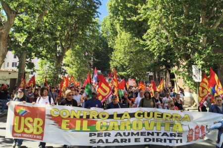 USB guerra carovita 1 Workers during May 23 demonstration. Sign reads: "Against war and the cost of living crisis to increase wages and rights." Source: Unione Sindacale di Base