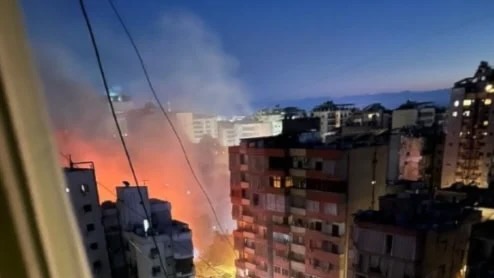 flames and smoke rise after Israeli strikes on Beirut